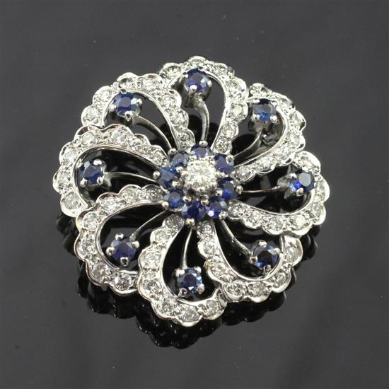 A modern 18ct white gold, diamond and sapphire brooch, 1.25in.
